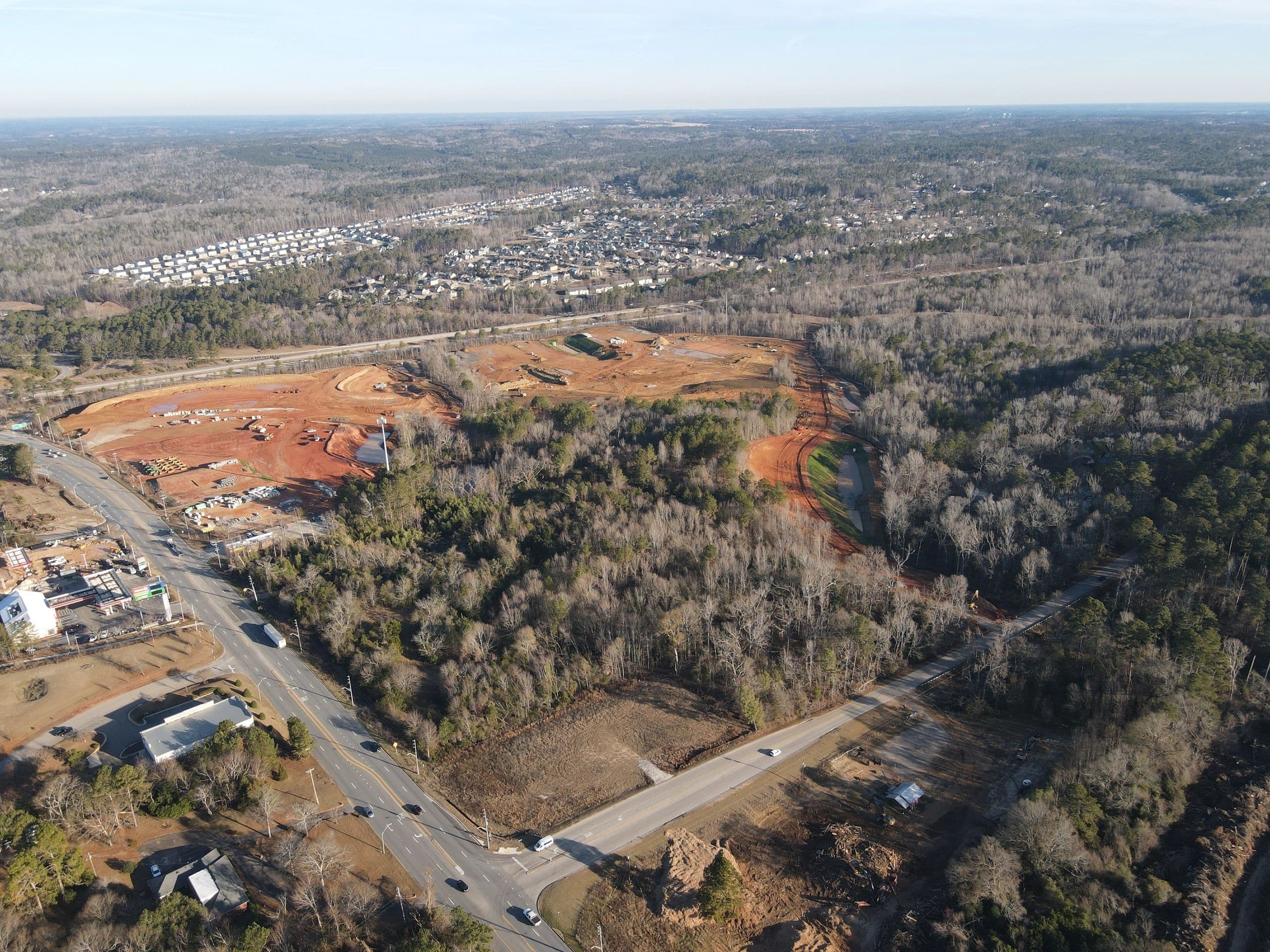 Winter drone aerial of mass grading across The Hive site near I-20